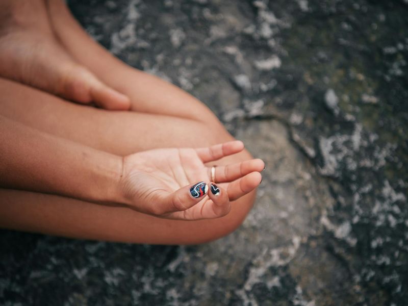 Close up of hands in a meditative position